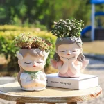 7 inch Cute Angel Girl Face Planter Pot with Drainage Hole, Resin Fairy Tale Planter Ornamental Statues for Home Office Decor - Image 4